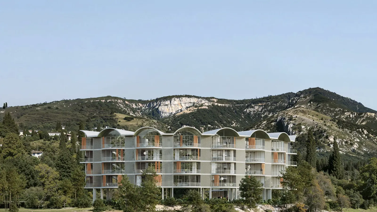 Skleněné fasády budov Radisol Residence nedaleko pláže v Radhimë